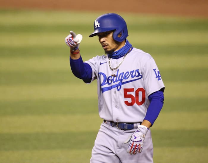 Sep 8, 2020; Phoenix, AZ, USA; Los Angeles Dodgers Mookie Betts (50) reacts after hitting an RBI-single against the Arizona Diamondbacks in the seventh inning at Chase Field. Mandatory Credit: Rob Schumacher/The Arizona Republic via USA TODAY NETWORK Mlb Los Angeles Dodgers At Arizona Diamondbacks